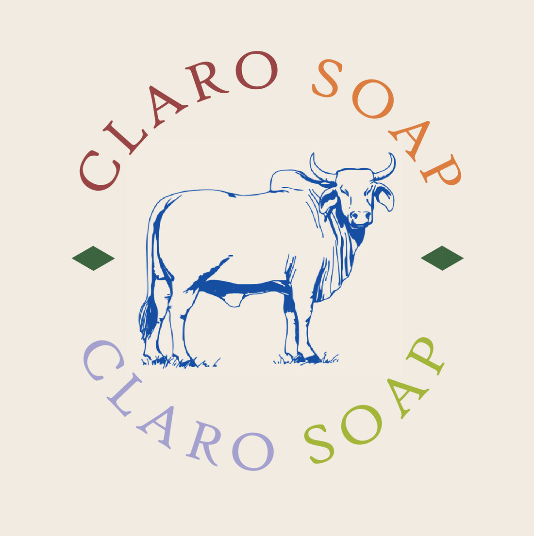 Claro Soap logo featuring a minimalist blue illustration of a cow in the centre, surrounded by the brand name 'Claro Soap' in an arching circle with multi-coloured letters in red, orange, green, and purple on a cream background.